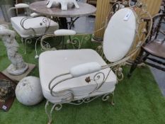 A PAIR OF WROUGHT IRON LOW CONSERVATORY CHAIRS WITH CUSHION SEATS AND BACK PANELS. (2)