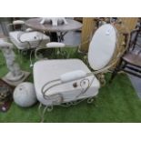 A PAIR OF WROUGHT IRON LOW CONSERVATORY CHAIRS WITH CUSHION SEATS AND BACK PANELS. (2)