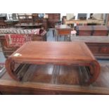 A CARVED HARDWOOD CHINESE LOW TABLE WITH INCURVED LEGS. W.92cms.