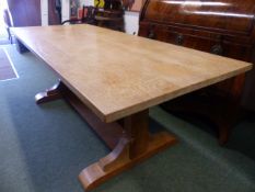 A HEALS ARTS AND CRAFTS PALE OAK REFECTORY TABLE ON STOUT CHAMFERED SQUARE ENDS SUPPORTS. 214 CM X
