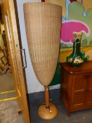 A PAIR OF CONTEMPORARY STANDARD LAMP UPLIGHTERS WITH LARGE RATTAN SHADES. H.180cms.