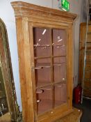 A 19th.C.COUNTRY PINE CORNER CABINET WITH GLAZED PANEL DOOR ABOVE CUPBOARD SECTION. W.78.