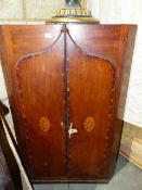 A GEO.III. MAHOGANY WALL HANGING CORNER CABINET WITH TWO SHAPED DOORS FORMING A GOTHIC ARCH,