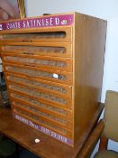 A VINTAGE MULTI DRAWER SEWING THREAD ADVERTISING SHOP DISPLAY CABINET WITH NINE DRAWERS. W.46 x H.