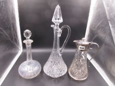 A SILVERPLATE MOUNT GLASS CLARET JUG, ANOTHER WITH SPIRE STOPPER AND A GLOBE AND SHAFT DECANTER