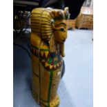 A CARVED WOOD AND POLYCHROME EGYPTIAN MUMMY CASE WITH INTERNAL FIGURE. L.64cms.