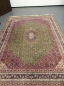 AN ORIENTAL CARPET OF PERSIAN TABRIZ DESIGN. 370 x 276cms.