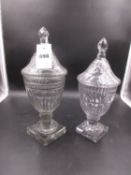 TWO SIMILAR CUT GLASS SWEETMEAT JARS AND COVERS, BOTH OF THE OVOID BOWLS ON FACETTED GLASS KNOPS AND