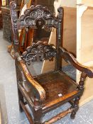 AN ANTIQUE 17th.C.STYLE CARVED OAK PANEL SEAT ARMCHAIR, FOUR MATCHING SIDE CHAIRS AND A SIMILAR