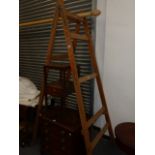 A PAIR OF LARGE VINTAGE WOODEN DECORATOR'S A-FRAME TRESTLE STANDS.