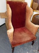 A GEO.III. WINGBACK ARMCHAIR ON SQUARE LEGS UNITED BY STRETCHERS.