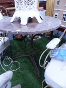 AN ANTIQUE WROUGHT IRON GARDEN OR PATIO TABLE WITH VEINED MARBLE CIRCULAR TOP.Dia.77 x H.73cms.