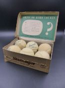 A FULL BOX OF 1950'S SLAZENGER TENNIS BALLS, THE LID OF THE BOX BEARING AN INDISTINCT SIGNATURE.