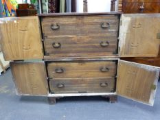 AN ANTIQUE CAMPHORWOOD TWO PART CAMPAIGN CHEST OF FOUR DRAWERS WITH IRON HANDLES ENCLOSED IN TWO