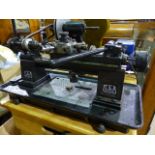 A PULTRA MODEL OR WATCHMAKER'S LATHE WITH CAPSTAN TOOL HEAD AND VARIOUS ATTACHMENTS,