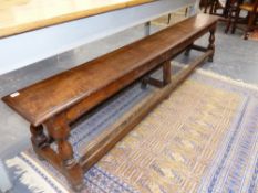 AN ANTIQUE OAK FORM WITH STRETCHERED TURNED SUPPORTS. W.224cms.