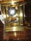 A FRENCH STYLE GILT BRASS AND SILVERED MANTLE CLOCK, THE 8-DAY DRUM HEAD MOVEMENT SUPPORTED ON THE