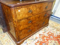 A VICTORIAN BURR WALNUT CHEST OF THREE LONG DRAWERS ON A PLINTH BASE. 114 x 53cms.