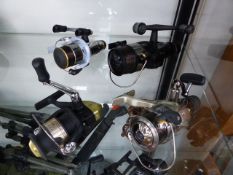 A SHIMANO FISHING REEL ON PIKE FLEX ROD AND FOUR FURTHER SHIMANO REELS. (6) (B)