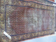 AN ANTIQUE PERSIAN TABRIZ RUG. 193 x 142cms TOGETHER WITH TWO SEREBAND RUGS AND A SHIRAZ RUG. (4)