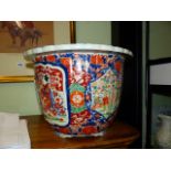 A JAPANESE IMARI JARDINIERE WITH UNUSUAL MOULDED RELIEF FIGURAL DECORATION. Dia.39cms.