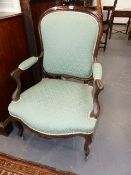 A PAIR OF FRENCH LOUIS XV STYLE CARVED ARMCHAIRS WITH SHAPED BACKS AND SEATS.