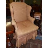 AN EARLY 20th.C.GEO.II.STYLE WING BACK ARMCHAIR ON TURNED LEGS AND STRETCHERS.