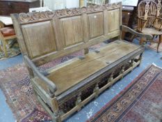 AN EARLY 18th.C.AND LATER OAK PANEL BACK HALL SETTLE WITH SHALLOW BOX SEAT. W.184 x D.61 x H.