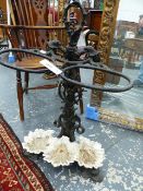 A 19th.C.CAST IRON STICKSTAND WITH DOLPHIN BASE AND STYLISED CORAL AND SEAWEED DECORATION. H.80cms.