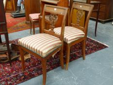 A SET OF FOUR NORTH EUROPEAN BEECH AND ELM SIDE CHAIRS WITH BRASS MOUNTED TOP RAIL OVER CARVED