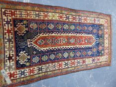 AN ANTIQUE CAUCASIAN KAZAK RUG. 250 x 126cms.