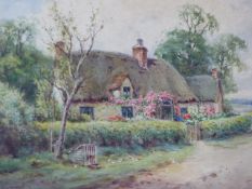 D.HENRY SYLVESTER STANNARD. (1870-1957) ARR. THATCHED COTTAGE, SIGNED WATERCOLOUR. 24 x 34cms.