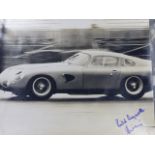 AN INTERESTING PHOTOGRAPH OF 1963 ASTON MARTIN RACE CAR TESTING AT SILVERSTONE, INSCRIBED VERSO