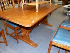 ALAN GRAINGER. ACORNMAN. A REFECTORY TABLE WITH ADZE FINISH TOP OVER TRESTLE ENDS UNITED BY