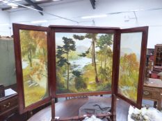 A VICTORIAN AND LATER MAHOGANY FOLD OUT FIRESCREEN WITH ELABORATE FLORAL AND LANDSCAPE PAINTED INSET