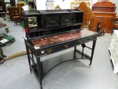 A LATE VICTORIAN MAHOGANY AESTHETIC MOVEMENT EBONISED WRITING TABLE WITH RAISED CABINET AND PIGEON