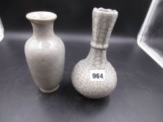 TWO CHINESE GUAN TYPE GREY CRACKLEWARE VASES, ONE OF BOTTLE SHAPE WITH FLUTING BELOW THE SERRATED