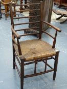 AN ARTS AND CRAFTS MORRIS TYPE SUSSEX CHAIR WITH RUSH SEAT.