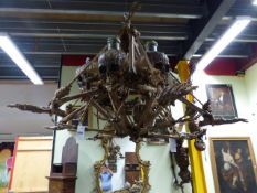 HORROR FILM PROPS. A WELL CAST RUBBERISED MODEL OF A SKULL AND BONES CHANDELIER.