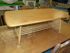 AN ERCOL PALE ELM COFFEE TABLE. 105 x 46cms