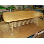 AN ERCOL PALE ELM COFFEE TABLE. 105 x 46cms