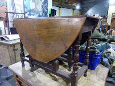 AN 18th.C.OAK SMALL COTTAGE GATELEG SUPPER TABLE ON TURNED SUPPORTS.