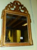 AN EARLY 19th.C.CARVED GILTWOOD SMALL MIRROR.