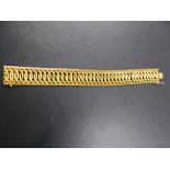 A 750 STAMPED (TESTS AS GOLD) LADIES WOVEN SNAKE LINK DECORATIVE BRACELET, LENGTH 20cms, 32.4grms.