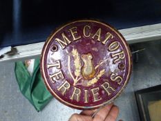 A VINTAGE CIRCULAR BRONZE NAME PLATE, MECATOR TERRIERS, CENTERED WITH A RELIEF OF A FIELD MOUSE.