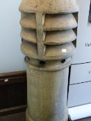 A GROUP OF SEVEN VINTAGE TERRACOTTA AND STONEWARE CHIMNEY POTS OF VARYING DESIGNS AND SIZES. LARGEST