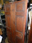 AN 18th.C.PINE PANELLED DOOR. 198 x 90cms.