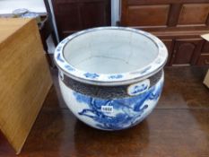 A LARGE ORIENTAL BLUE AND WHITE CRACKLE GLAZE JARDINIERE. Dia. 38cms.