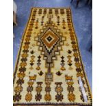 A NORTH AFRICAN TRIBAL RUG. 264 x 126cms.