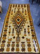 A NORTH AFRICAN TRIBAL RUG. 264 x 126cms.